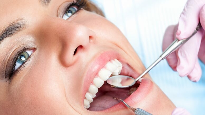 Woman Getting Her White Teeth Checked